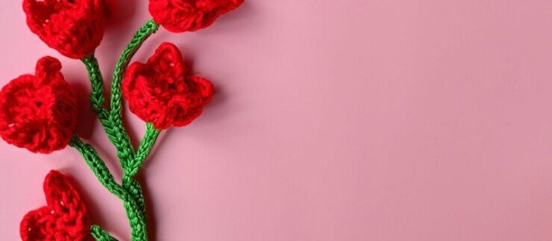 composition-red-tulips-made-crochet-wool-bottom-with-copy-space-pink-background_874813-20123